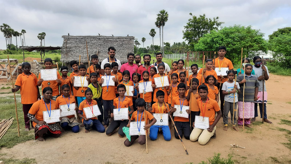 Agathiyar Silambam students proudly holding their medals and certificates — State and National champions