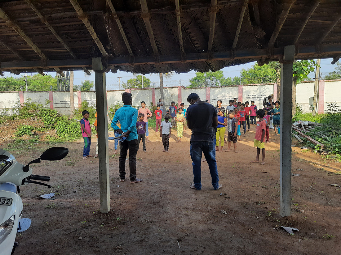 Students practising silambam under the eco shade