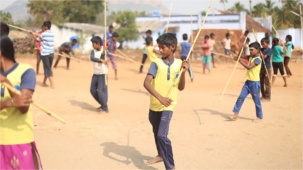 Students practising silambam at Agathiyar Silambam School